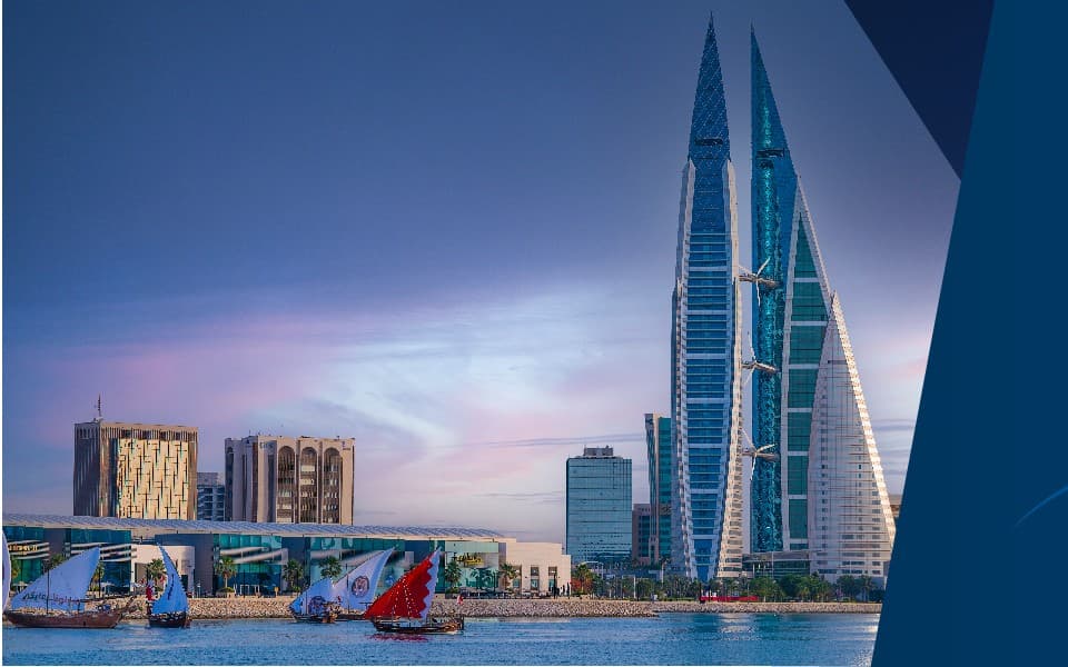 Manama skyline at dusk with the Bahrain World Trade Center